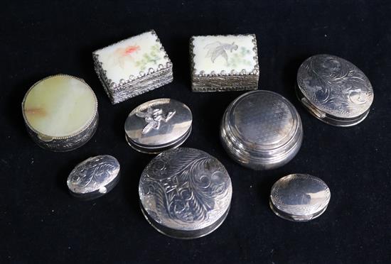 Three modern silver pill boxes.